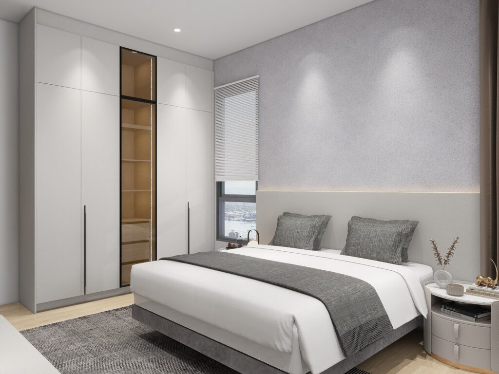 A built-in wardrobe built floor to ceiling into a compact bedroom corner. 