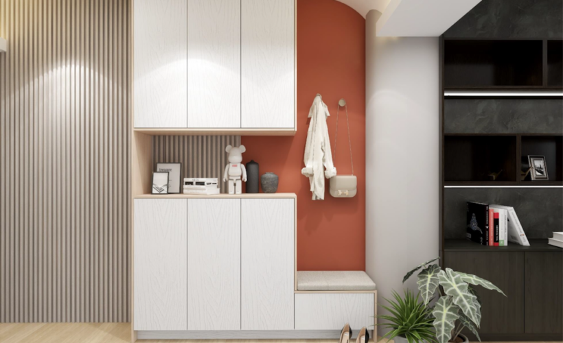 Foyer with white cabinets, slatted panel, and a warm terracotta feature wall.