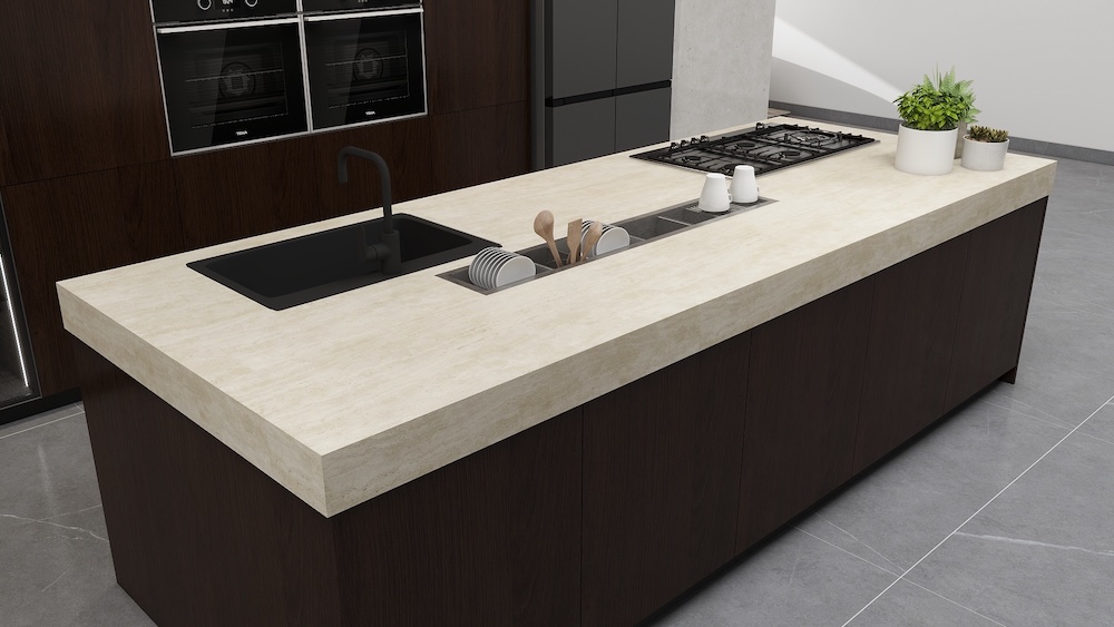 Close-up of kitchen island countertop with integrated sink and gas hob.