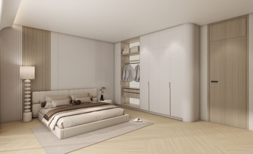 Swing door wardrobe with open interior in a master bedroom.