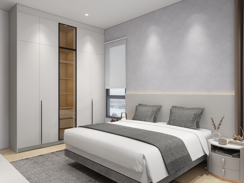 Built-in wardrobe with full-height sliding doors in a Malaysian bedroom.