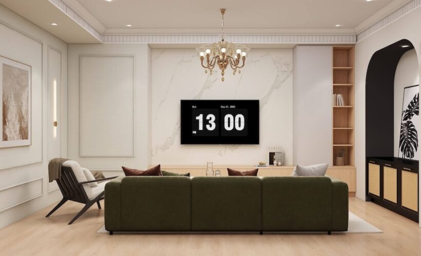 Living room with wainscoting beside a TV feature wall.