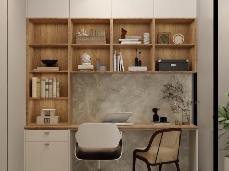 Malaysian study corner with a warm grey feature wall, built-in wood shelving and a desk